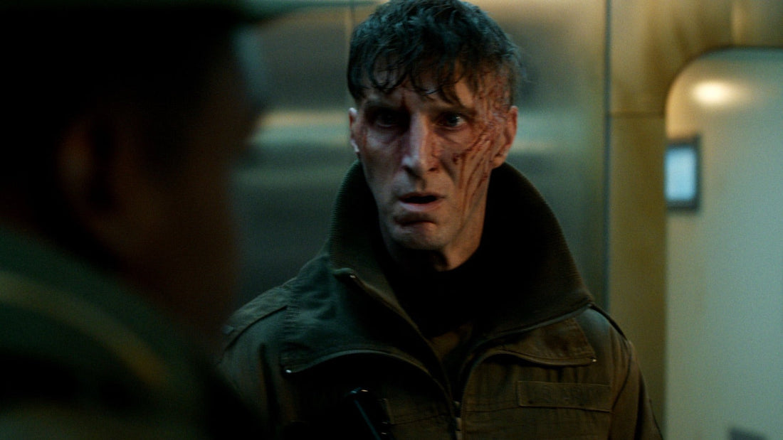 Lieutenant Robert Akers, his face scratched, in a military jacket.