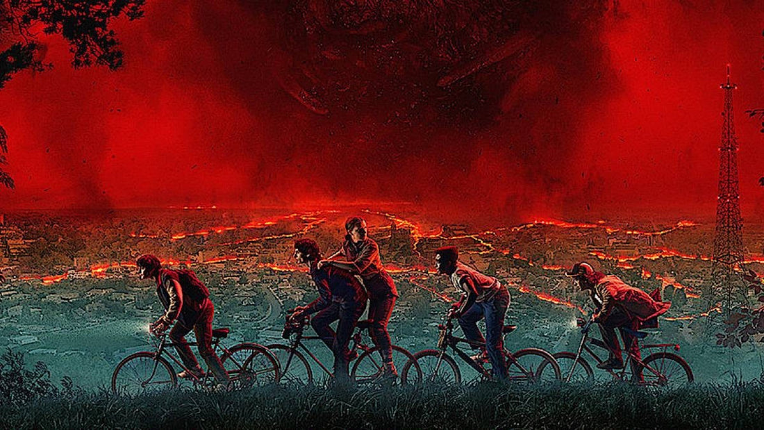 Artwork: four bikes racing in profile, a passenger standing at the back, under the red Hawkins sky