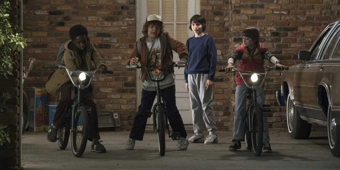 Three kids on bikes surround a boy in a blue sweatshirt: who is the main character of Stranger Things?