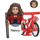 Buildable mini figure Stranger Things Nancy Wheeler on a bike