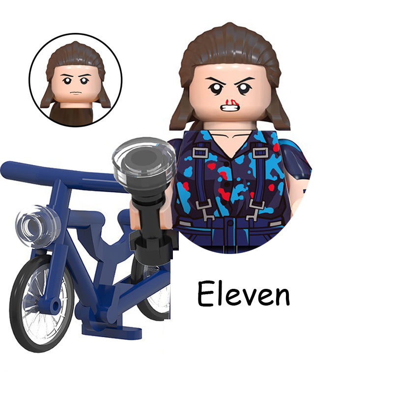 Mini figurine à construire Stranger Things Onze et son vélo bleu vu de face