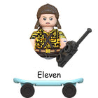 Buildable mini figure Stranger Things Eleven on a skateboard